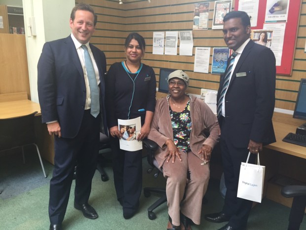 Ed Vaizey, Minister of State for Culture and the Digital Economy, at Nunhead Library in south London with Barclays Digital Eagles Prasanna Kousalya (l) and Jitto Chittapalli (r) and Folashade Okon (seated).